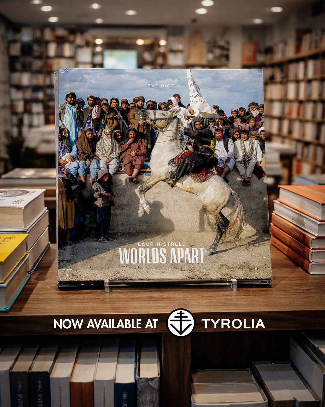 The Worlds Apart photobook by Laurin Strele displayed with documentary photography at Tyrolia.