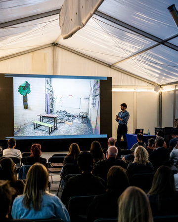 Laurin Strele presenting Witnessing Conflict at Fotomesse Tirol in Innsbruck, 25 September 2026. Photo: Fabian Sorger.