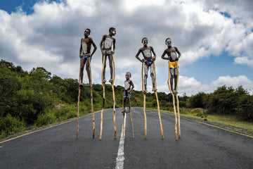 Hamar Kids on Stilts — fine art photograph by Laurin Strele