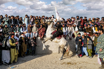 Winning buzkashi rider and horse in Afghanistan — photograph by Laurin Strele