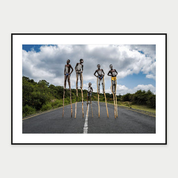 Black-framed display mockup of Hamar Kids on Stilts by Laurin Strele; frame shown for illustration.