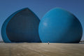 A lone visitor stands before the Al-Shaheed Monument in Baghdad, Iraq. Photograph by Laurin Strele; image preview for the photo poster.