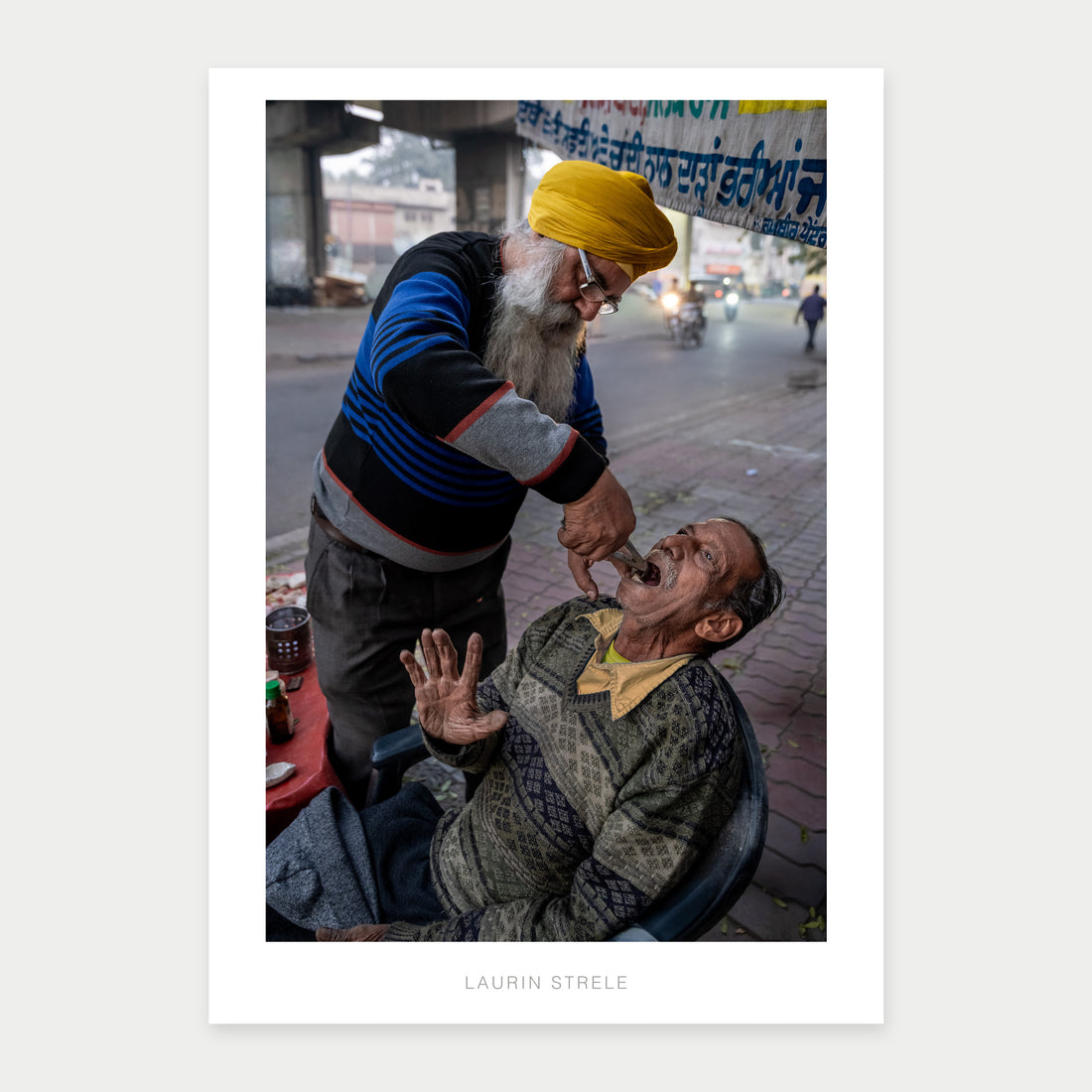 A1 poster of The Street Dentist in Amritsar, India, by Laurin Strele, shown with a white border and light-grey artist name.