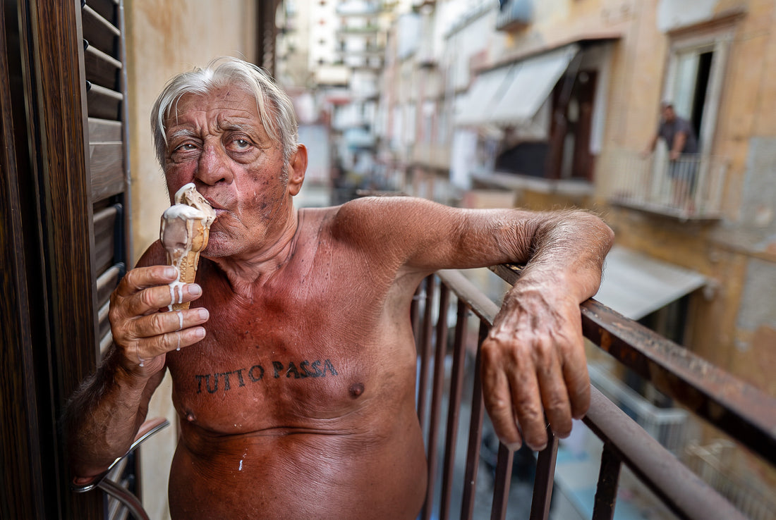 A1 poster of a man eating ice cream on a balcony in Naples, Italy, by Laurin Strele, with a white border and light-grey artist name.