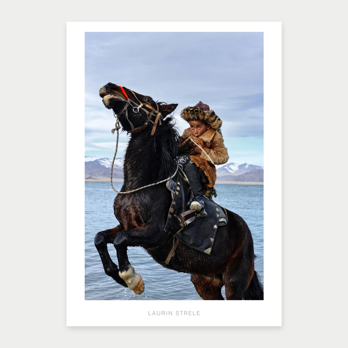 A1 photo poster of Young Eagle Hunter, Mongolia by Laurin Strele, shown with a white border and light-grey artist name.